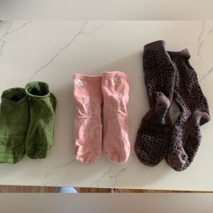 Three pairs of Pure Barre Socks. Low rise, mid, and high.